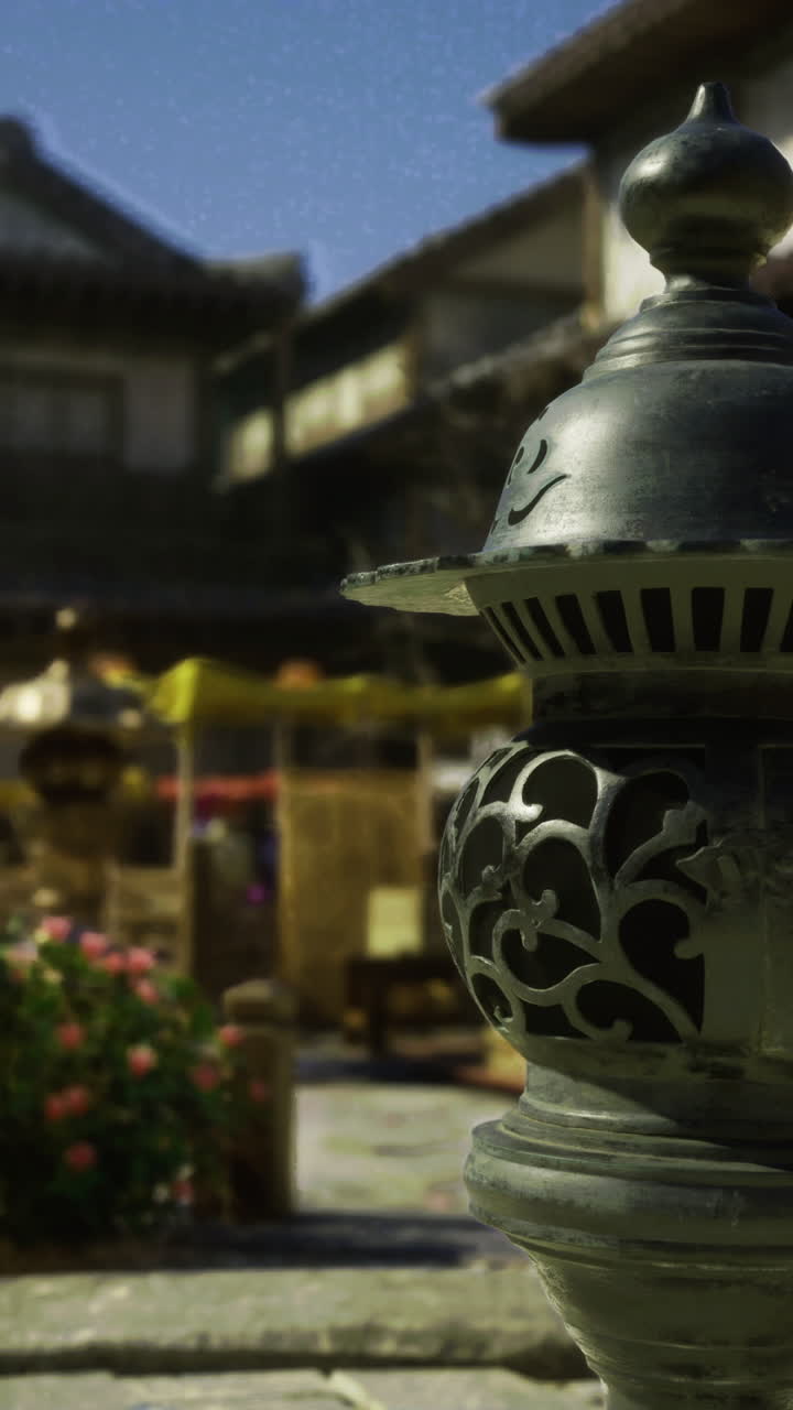 Lanterns illuminate a traditional village with intricate details at dusk