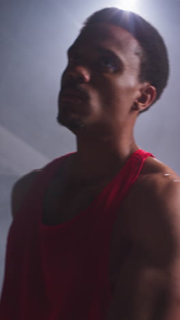 Vertical-Video-Of-Male-Boxer-Wearing-Gloves-Warming-Up-And-Throwing-Punches-In-Ring-Before-Start-Of-Boxing-Match-1