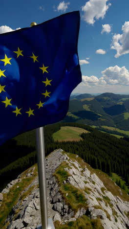 european union flag on mountain summit