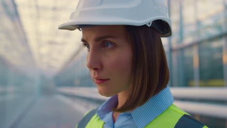 portrait woman engineer examining production factory inspection process smiling