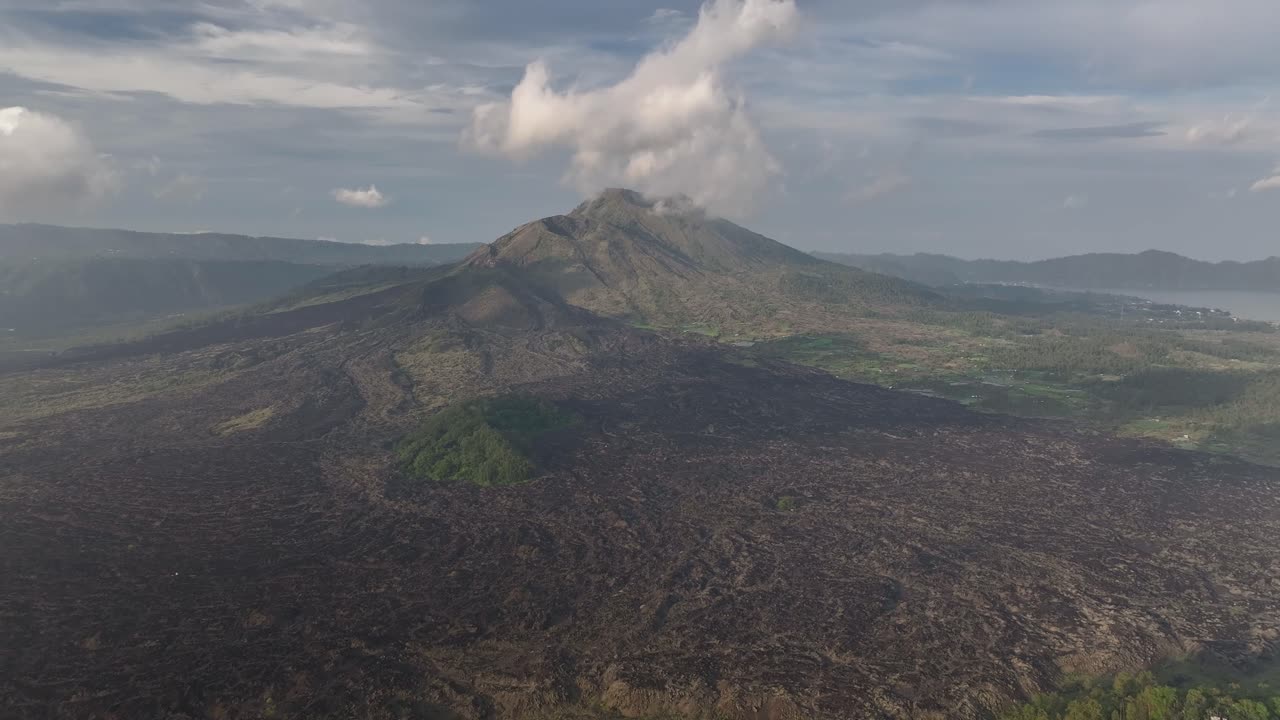 Mount Batur in Bali, Indonesia. Birds eye view of active volcano and volcanic landscape.