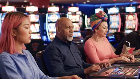 exciting moments at the casino: a group of friends enjoying games together while engaging with slot machines and sharing laughter in a vibrant atmosphere