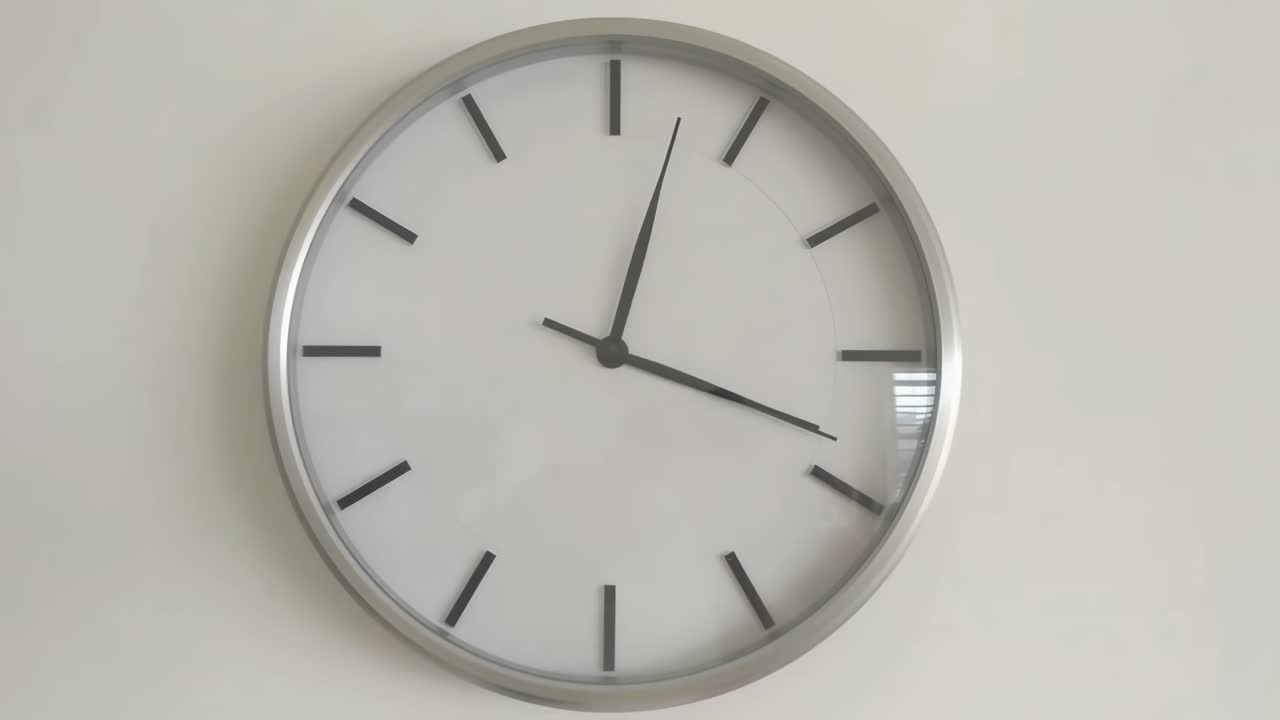 Minimalist wall clock captured in a straight-on angle, ideal for a time-lapse video