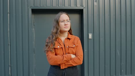 Woman-crossing-her-arms-showing-disapproval-or-disappointment,-static-closeup