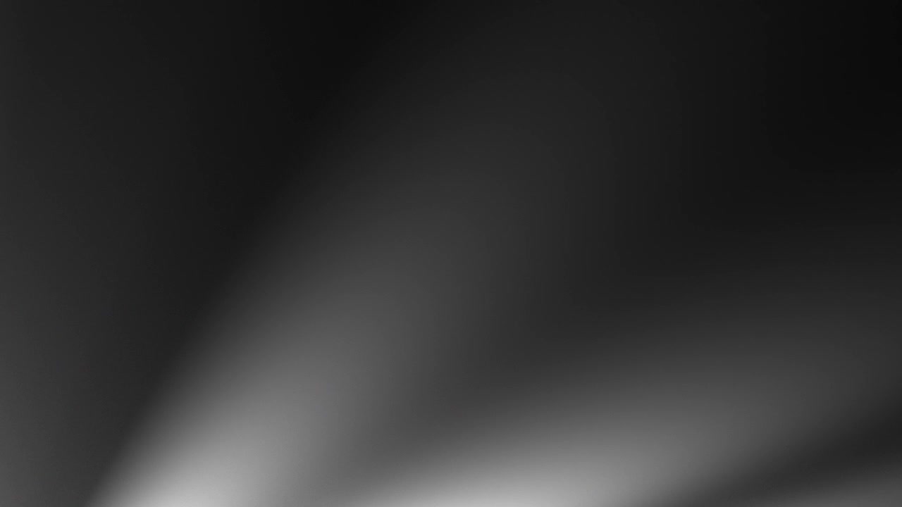 Soft Light Rays Spreading Across a Dark Abstract Background