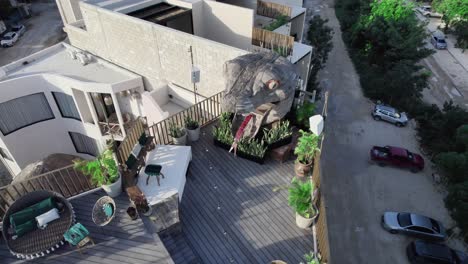 orbit shot of the roof of a unique house with a dragon-headed garden door