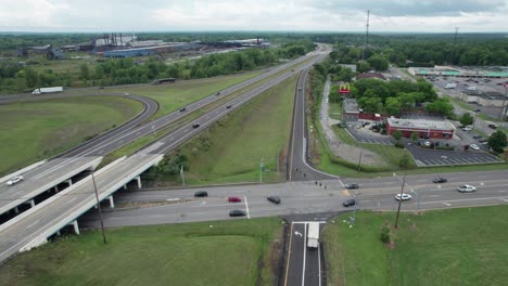 An-aerial-shot-over-the-evening-road-traffic-in-a-small-town