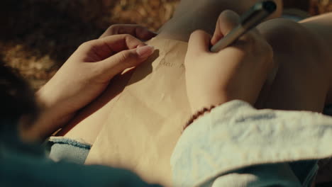 writing a letter outdoors
