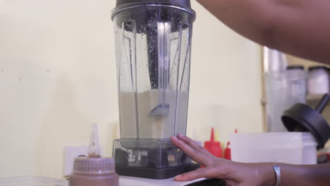 fresh smoothie in blender, selling street food - close up