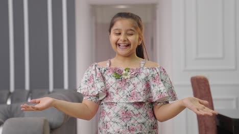 Happy-rich-Indian-kid-girl-throws-money-in-air