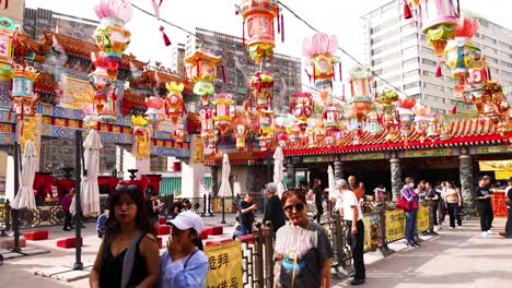 colorful lanterns and crowds at hong kong temple