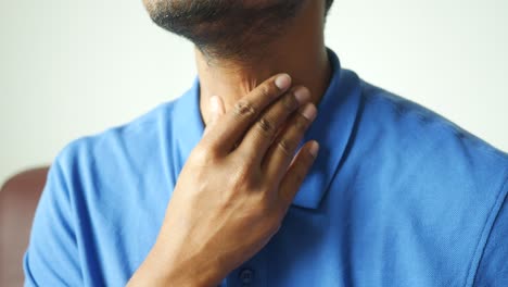 Unrecognized-man-suffering-throat-pain-close-up