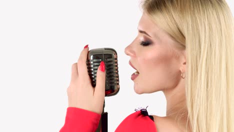 woman singing into a retro microphone