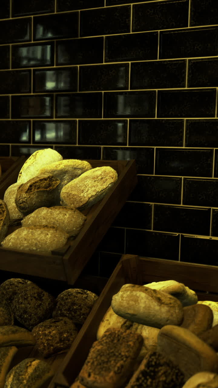 Freshly baked bread displayed in rustic wooden crates at a cozy bakery