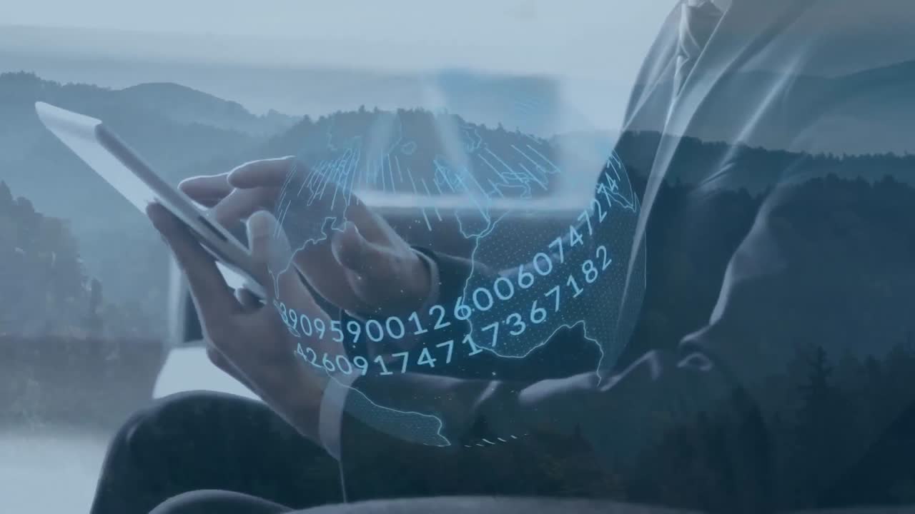 Animation of blue globe and data processing, over businessman using tablet at remote location