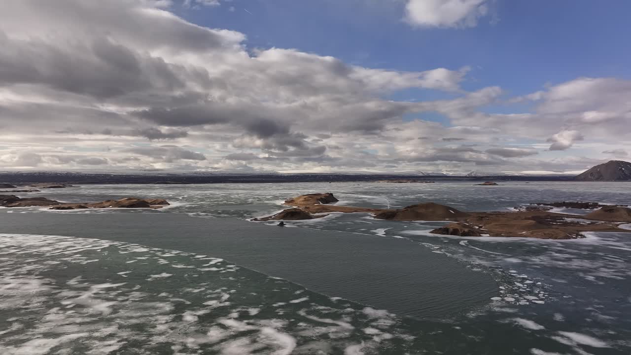 Frozen Water Of Lake Myvatn With Islets In Iceland. - aerial shot