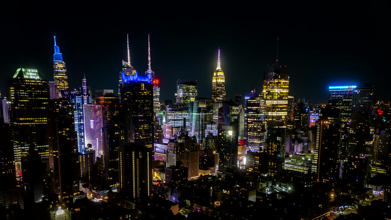 Stunning aerial view Hyperlapse of New York City in Manhattan at night with the Empire State lighten up.