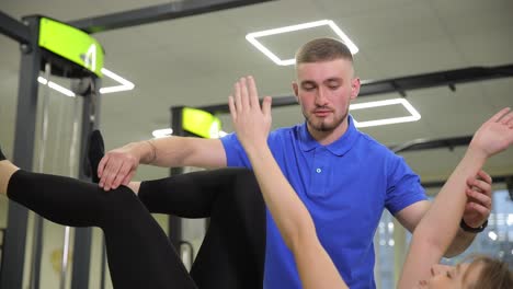 physical therapist assisting patient with exercise
