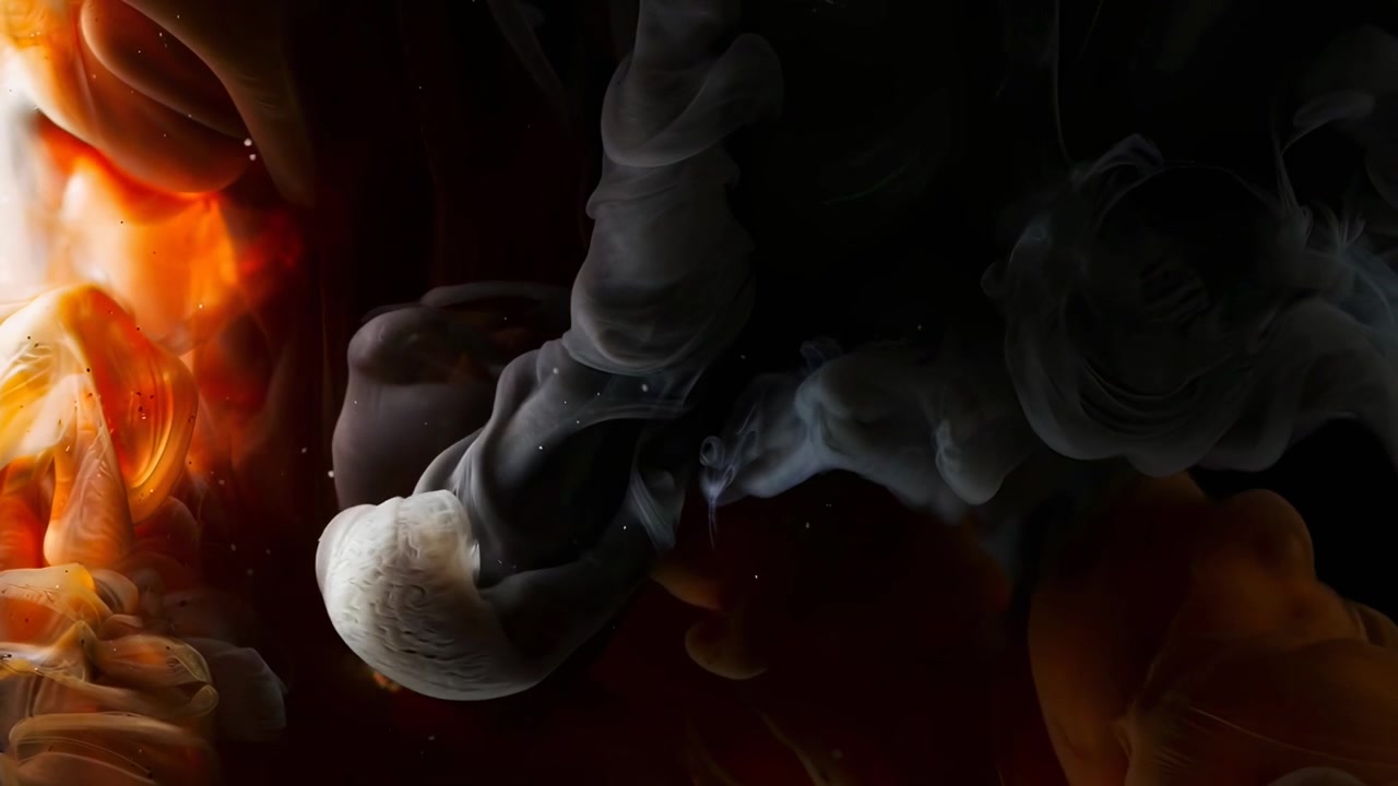 Abstract Orange and White Ink Swirling in Water
