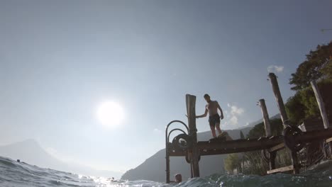 jumping in clear lake water, underwater view, holiday relaxation tourist