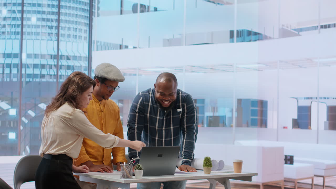 Business owner exchanging ideas with realtor and contractor during office tour