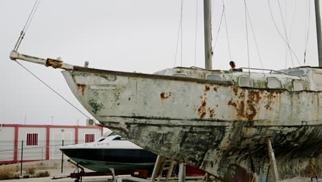 slow rotating shot showing the extensive rust damage to the hull of the ship