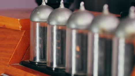 old retro am fm radio with tubes, hand changing stations , bulb vintage music player.