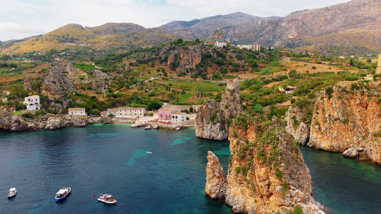 Rock Towers Of Faraglioni di Scopello In Castellammare del Golfo In Trapani, Italy. Aerial Drone Shot