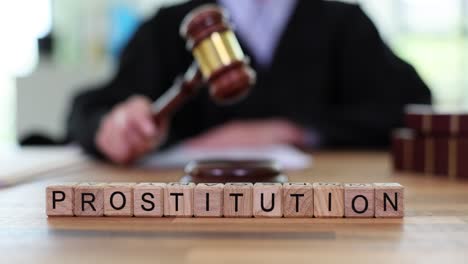 judge's gavel and 'prostitution' word blocks