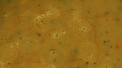 Cooking traditional Indian meal Palak Panir with spinach and cheese close up. Palak paneer is an Indian dish, consisting of paneer in a thick paste made from pureed spinach, Palak paneer is prepared by first boiling and pureeing spinach.