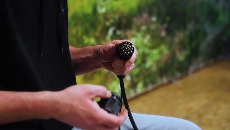 a man fixing a cable