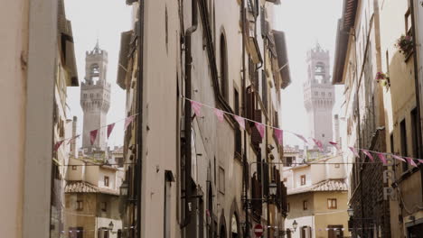 narrow street with historic buildings in florence, italy