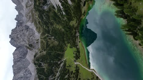 vertical drone shot of the alps mountain range