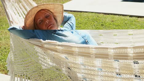 senior woman relaxing on hammock