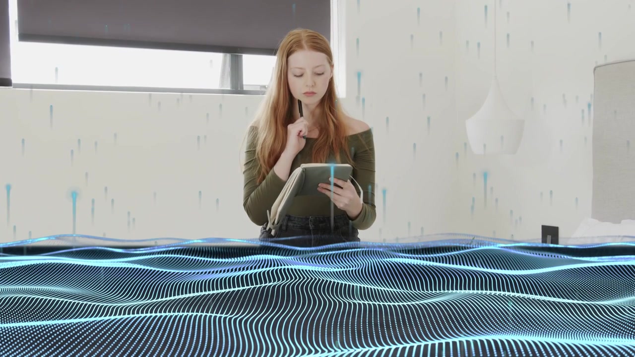 Woman opening folio taking tablet in bedroom, drawing design with stylus, blue grid obscuring frame