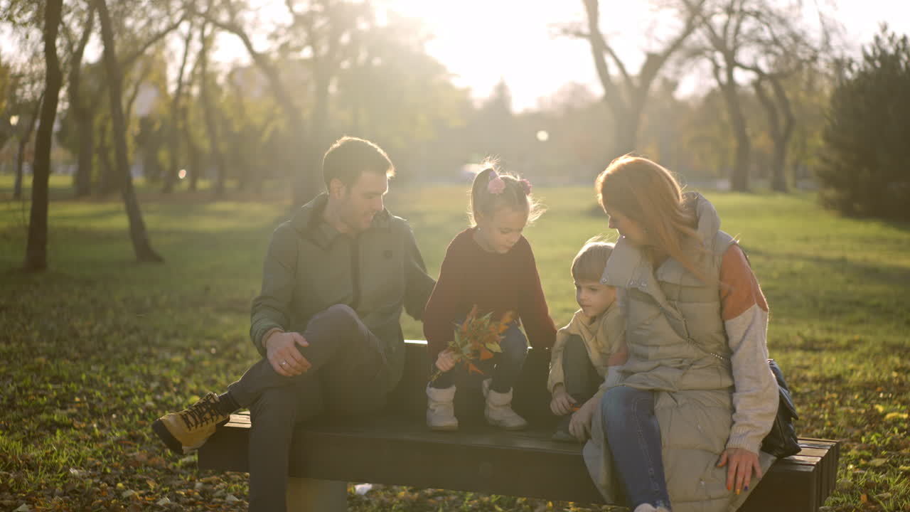 Family enjoying time together in the park during autumn