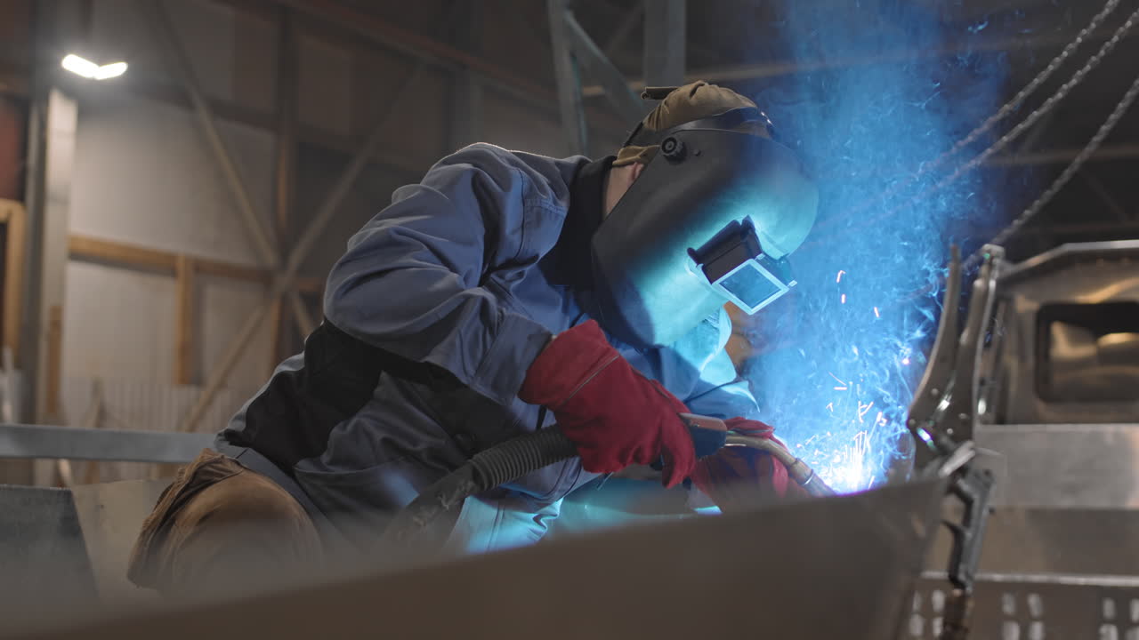 Welder at Work: Metal Fabrication in Progress