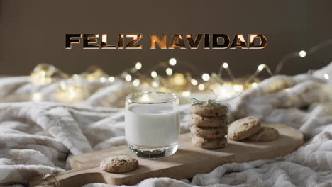 animation of feliz navidad text over cookies and milk