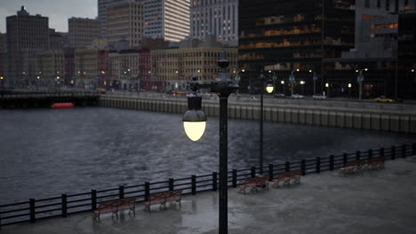 city lights reflecting on the water at night