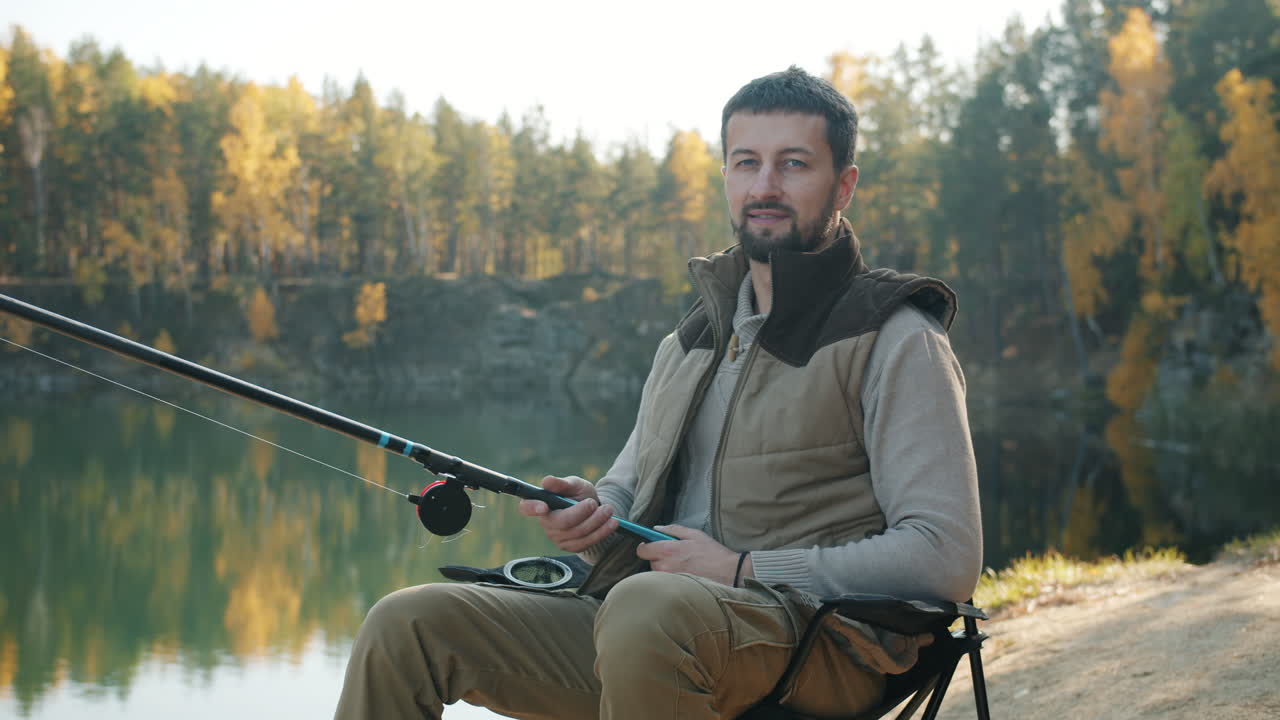 Man Fishing in Autumn Landscape