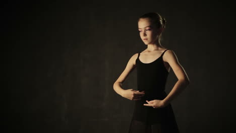 beautiful little girl ballerina dancing in ballet studio