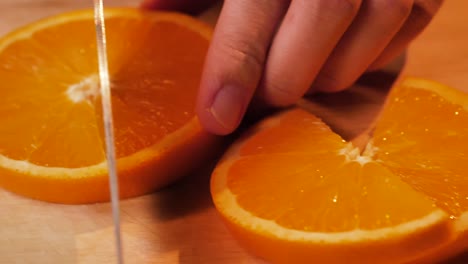 a slice of orange being cut in slow motion, uhd-1