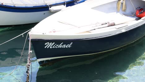 a boat named michael docked in sorrento, italy