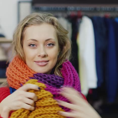 Portrait-Of-An-Attractive-Young-Woman-Wearing-A-Scarf