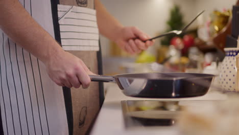 flipping pancake in pan close-up on pan