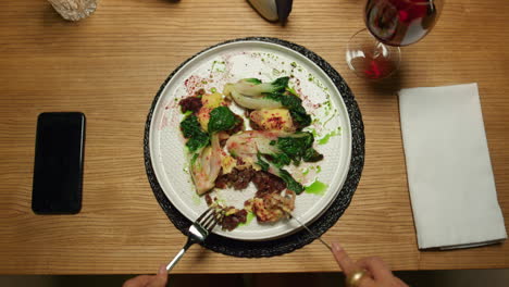 Woman-eating-vegetarian-dinner-at-restaurant-table-evening-date.-Lunch-concept.