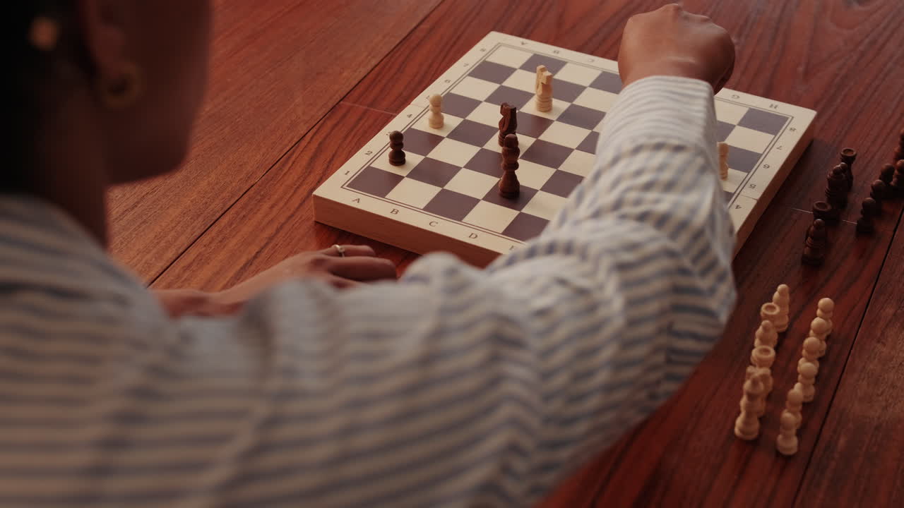 Woman Playing Chess: A Strategic Move