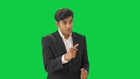 Indian-manager-motivating-employees-in-meeting-Green-screen