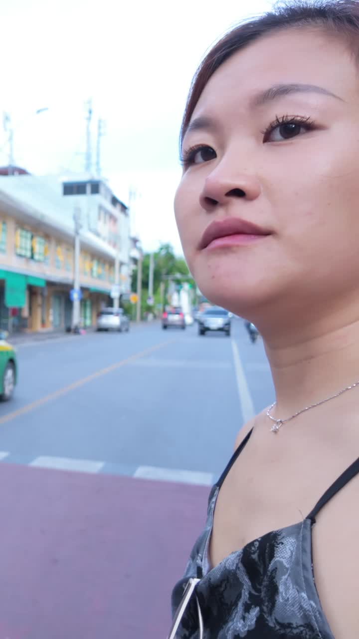 Woman with tattoo on a city street