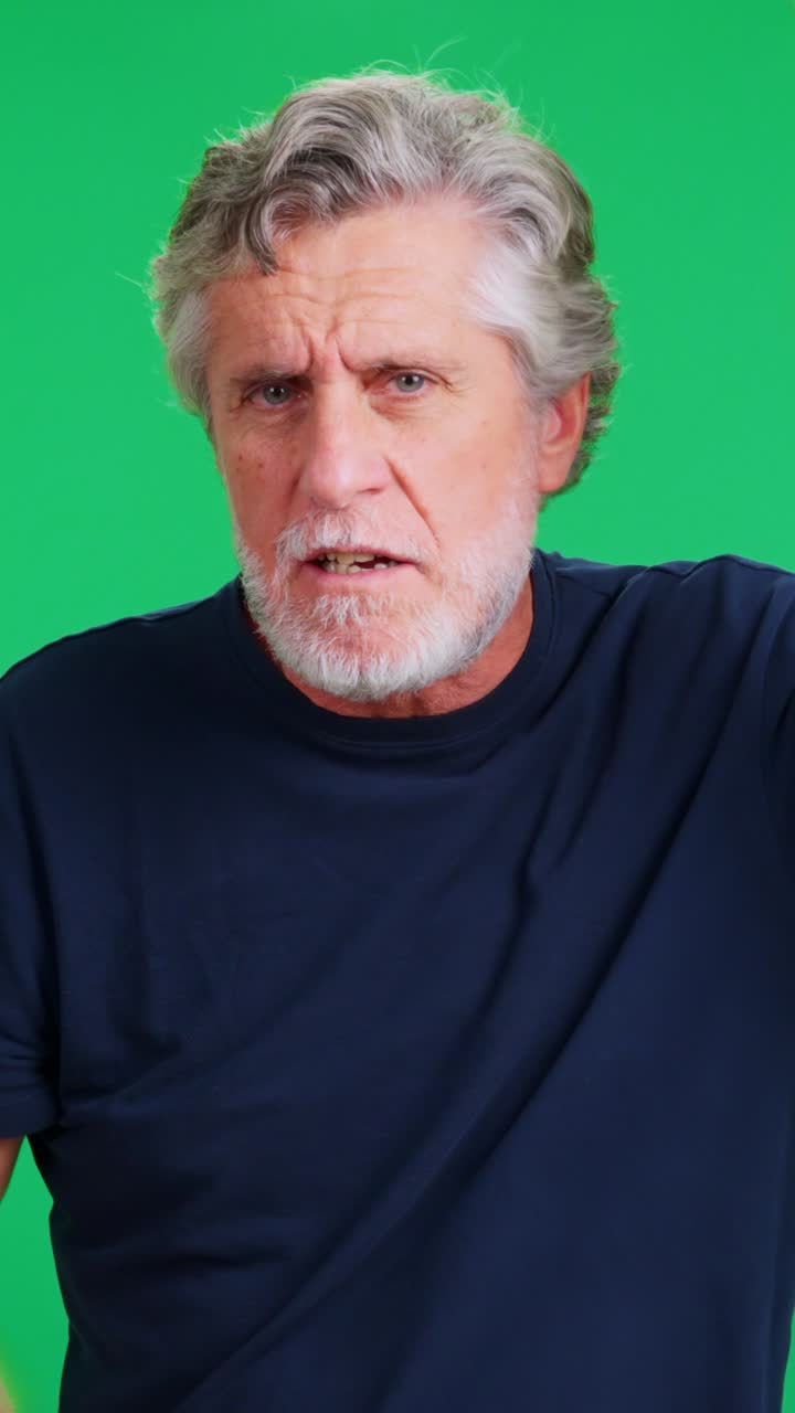 Older Man Talking and Gesturing Expressively on Green Screen